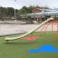 Copernicus steel structure on playground with colorful rubber surface.