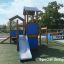 Tower playhouse with slide in playground
