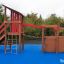 Sven's Boat single playhouse on a playground with climbing net and wooden structure
