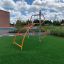 Steel playground climbing structure 'Cassiopeia' with orange bars.
