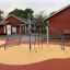 Playground equipment Cassiopeia, steel structure with climbing features on a soft surface.