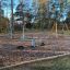 Children's playground with the Cassiopeia steel structure and wooden swings