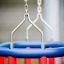 Chains holding blue and red Double Baby Swing.