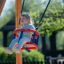 Double Baby Swing with a Little Girl Swinging Outdoors