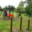 Somersault Double playground swing set with children playing in a park