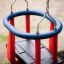 Double Swing for children with red bars and blue frame.