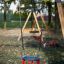 Double Swing on a playground with trees in the background