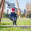 Child playing on Double Swing in a park