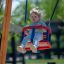 Child enjoying a swing ride on a Double Swing.