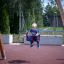 Toddler on Double Swing in a playground.