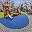 Galapagos wooden playhouse with slide in a residential courtyard