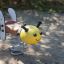 Children's spring rocker in the shape of a bee called Bee Rocking on a sandy playground.