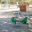 Grasshopper rocking on playground.