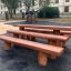 Outdoor wooden benches in playground.