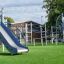 Ursa Maior castle with slide and climbing net on playground.