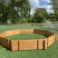 Outdoor wooden octagonal play arena, Octagon Arena I, on artificial grass field with soccer goals in