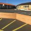 Wooden Octagon Arena II installed in a school playground.
