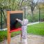 Child drawing on Blackboard 156 cm in a playground.