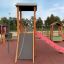 Epsilon inclusive playground with slide and climbing structures for children.