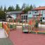 Epsilon inclusive playground with ramps and various play structures for children.