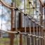 Wooden playground structure with climbing net - The Great Wall of China castle with slide.