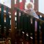A child climbing The Great Wall of China castle with slide by Lars Laj.