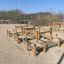 Balance Course outdoor playground structure with wooden and metal elements in a park.