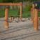 Trim trail wooden playground climbing ropes and balance beams on sand surface