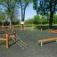 Trim trail outdoor fitness obstacle course made of wooden beams and ropes in a park setting