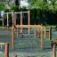 Trim trail outdoor wooden playground obstacle course with swings and climbing ropes