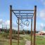 Horizontal ladder w/ climbing rings in playground setting