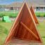 Tipi Nature wooden house playground equipment made of natural wood on green grass