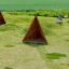Tipi Nature wooden house playground set on grassy field