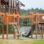 Khumbu castle with slide wooden playground structure with climbing ropes and slide