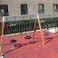 2+2 multiple swing playground set with tire and bucket seats in urban setting