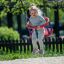 Child playing on 1+2 multiple swing in the park.