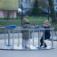 Wheelchair Accessible Merry-go-round with two children playing outdoors in winter clothing