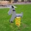 Spring-mounted children's playground ride shaped like a dog named Dog rocking.