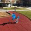 Blue Dog Rocking spring rider in a playground.