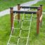 Wooden climbing frame with rope ladders, Trim Trail Line on grass.