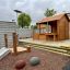Wooden Garden Playhouse w/ Fencing in children's play area