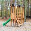 Outdoor play structure Mini Play Modern Nature with slide and ladder in wooded park.