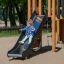 Child sliding down Challenger Modern Nature single slide on a playground.