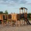 Challenger Modern Nature single slide wooden playground structure on sandy surface.