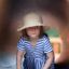 Child playing inside Windsor Modern Nature castle with slide