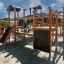 Windsor Modern Nature castle with slide in a playground setting
