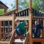 Children playing on Windsor Modern Nature castle with slide.