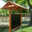 Outdoor Classroom with wooden benches, sunshade roof, blackboard, and plant pots in park setting