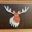 Forest Treehouse playhouse with slide featuring moose decoration