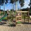 Forest Castle with slide playground equipment in a park